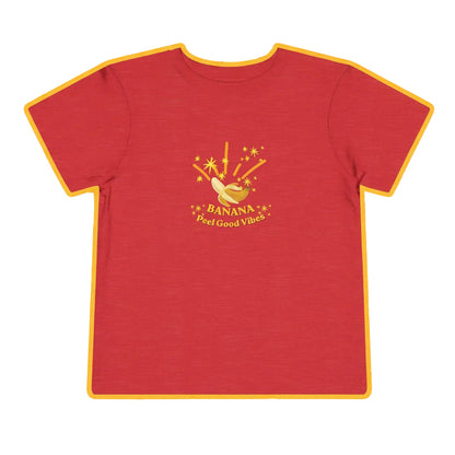 Red t-shirt with a banana graphic and text on a playful background