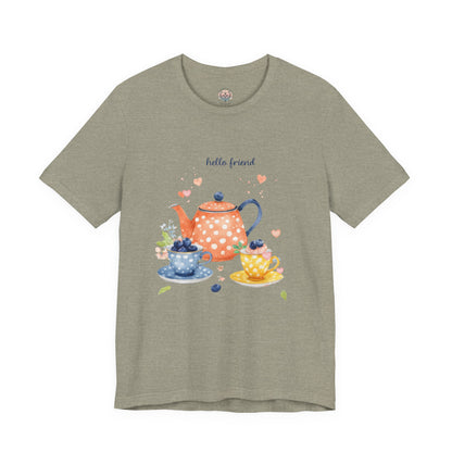 Green t-shirt with a tea-themed design and 'hello friend' text on a white background