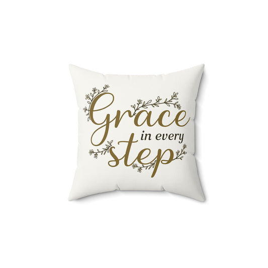 Pillow with 'Grace in every step' text on a white background