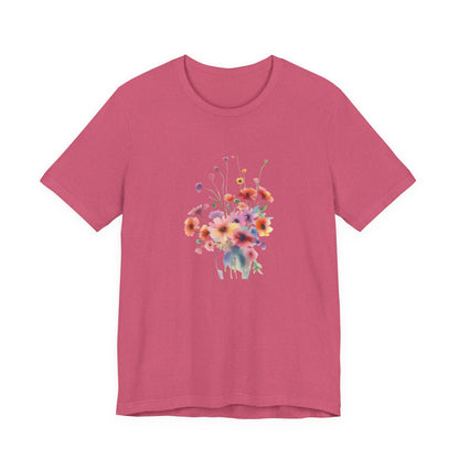 Pink t-shirt with a colorful floral design on a white background