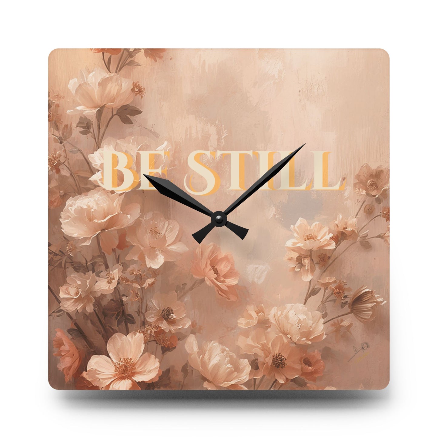 Square wall clock with floral design and 'Be Still' text on a white background