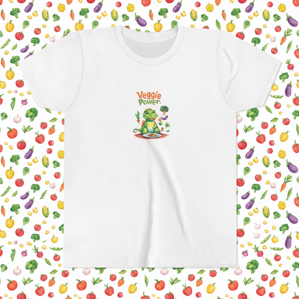 A white short-sleeve crewneck t-shirt featuring a colorful cartoon graphic of a green vegetable-themed influential dinosaur/ aligator with the text 'Veggie Power' printed above it.