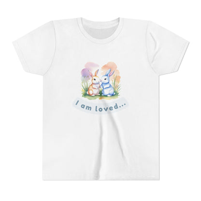 White t-shirt with cartoon bunnies and text on a white background