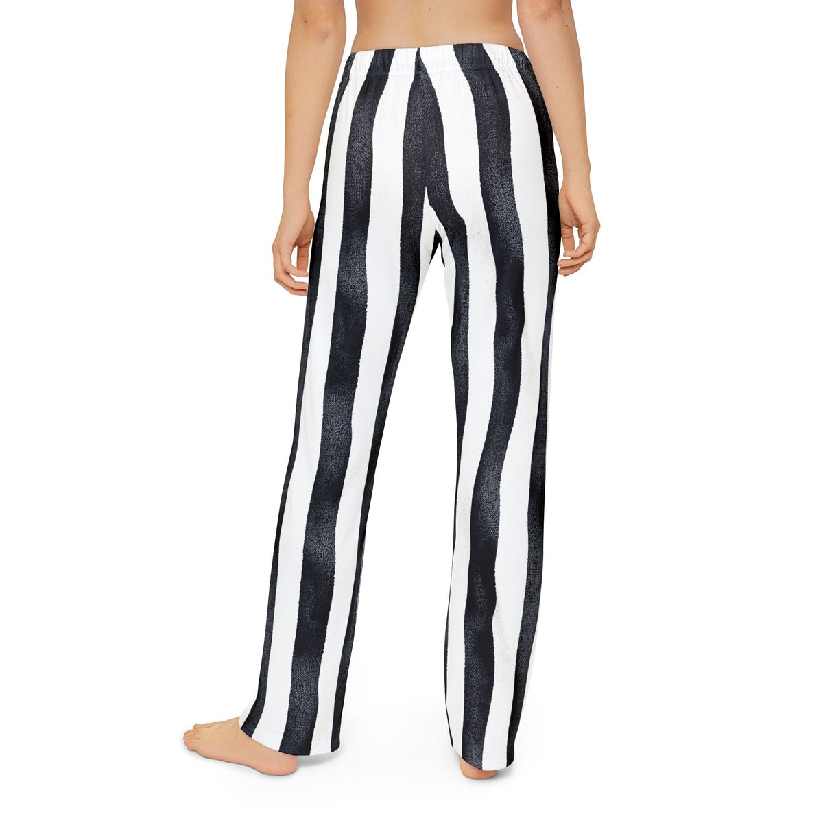 Kids black‑and‑white striped pants with a slight wiggle pattern for a playful pirate look.