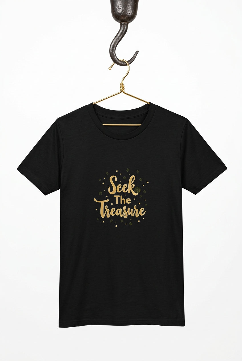 Kids black T‑shirt with golden “Seek the Treasure” lettering surrounded by small star accents.