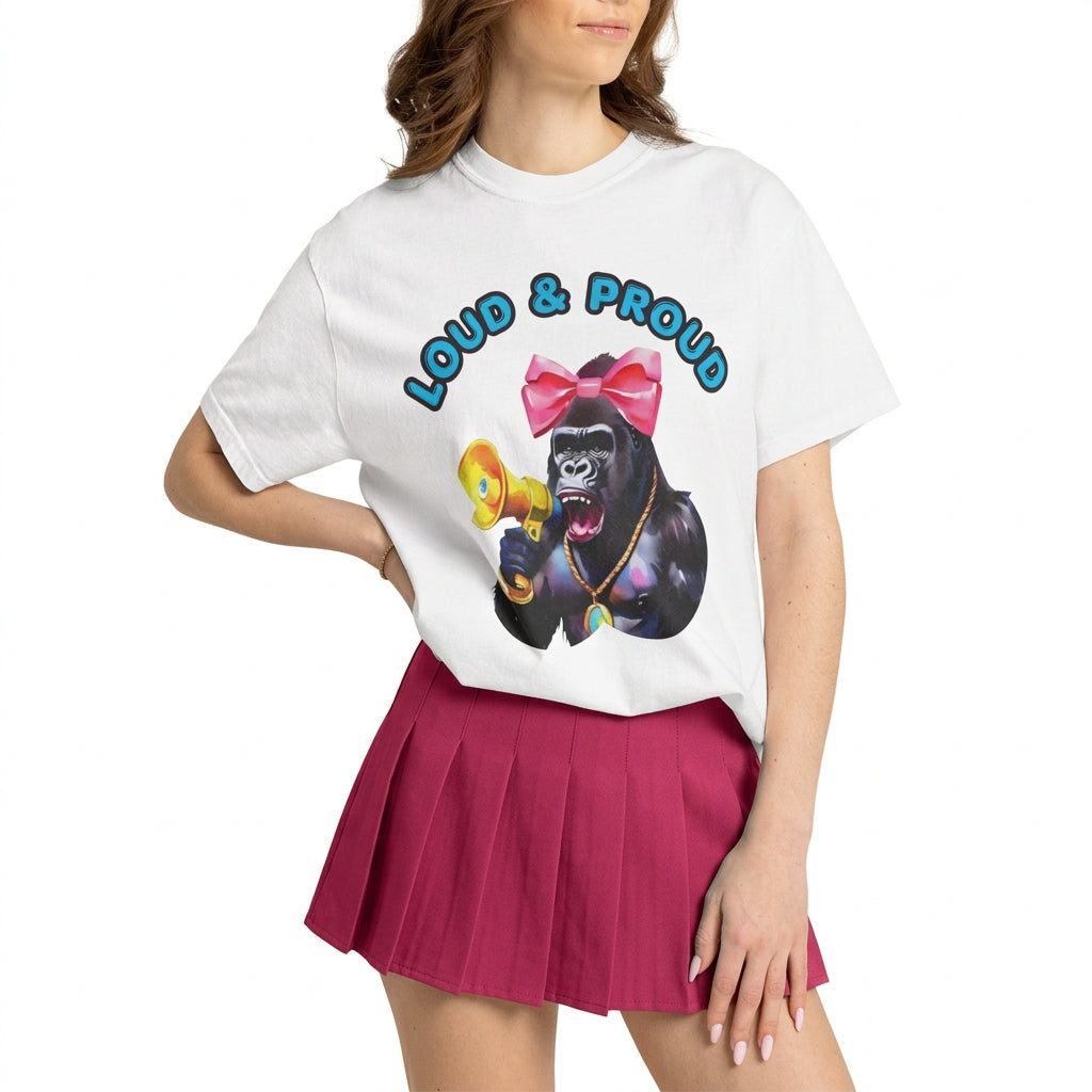 “Girl‑Girl™ cheerleader gorilla with pink bow and megaphone on a white unisex tee with the phrase ‘Loud & Proud.’” AI model wears a cheerleader skirt with the gorilla tee.