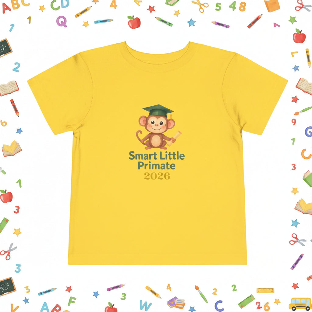 YellowToddler T‑shirt with a cheerful monkey wearing a graduation cap and holding a diploma, with the text ‘Smart Little Primate 2026" on the front.