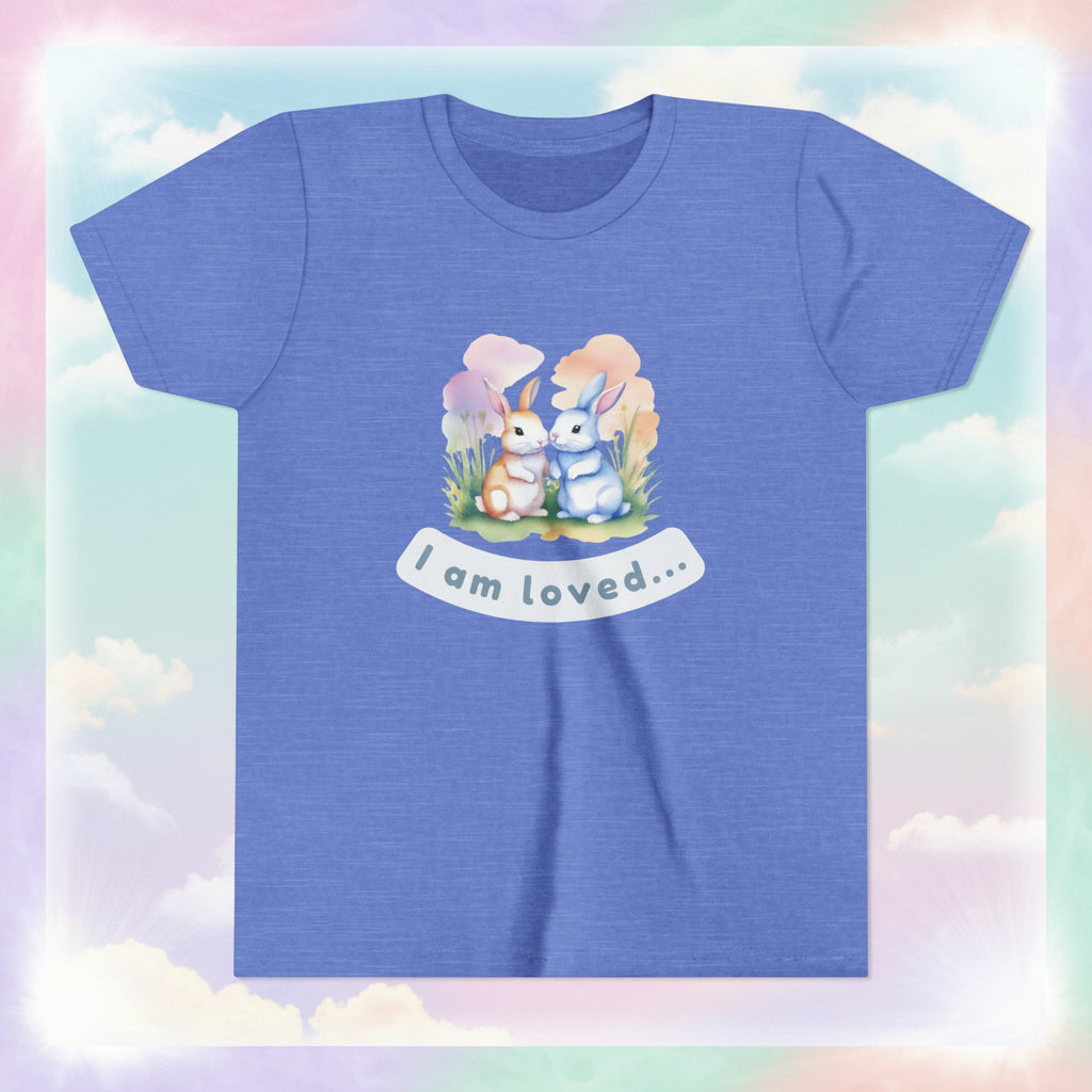 Blue t-shirt with cartoon bunnies and 'I am loved' text on a white background