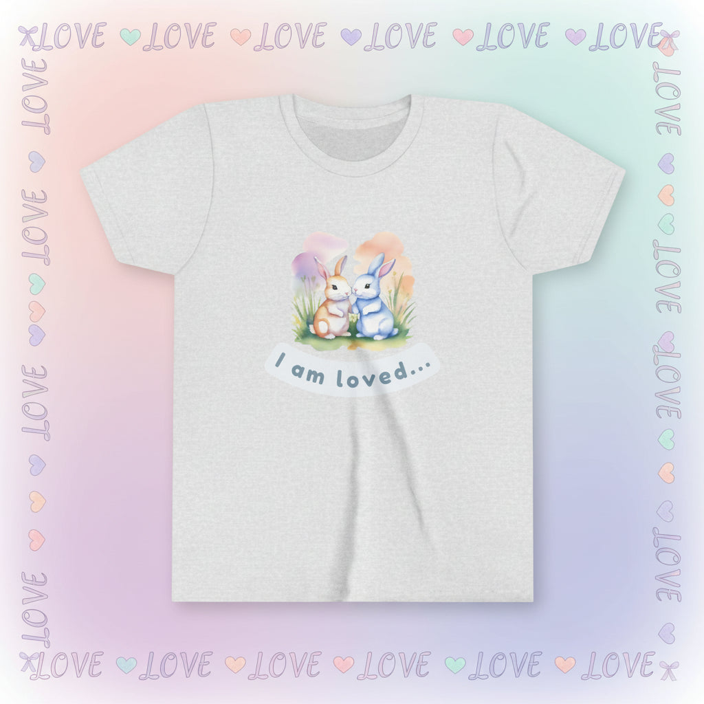 Gray t-shirt with cartoon bunnies and 'I am loved' text on a white background
