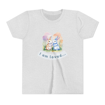Gray t-shirt with cartoon bunnies and 'I am loved' text on a white background