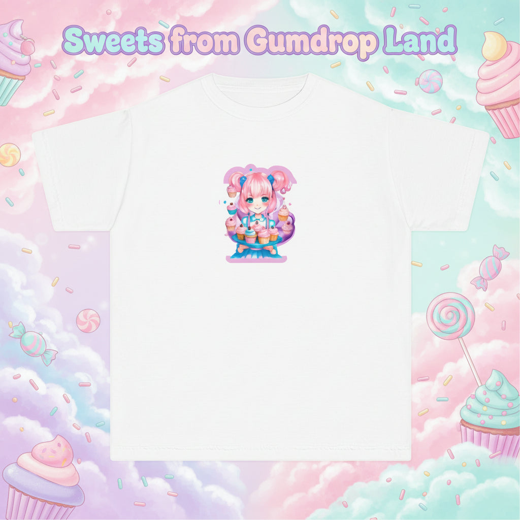 A white short-sleeve crewneck t-shirt featuring a colorful graphic print of a cute anime-style girl with pink hair and a cake on a stand, centered on the chest.
