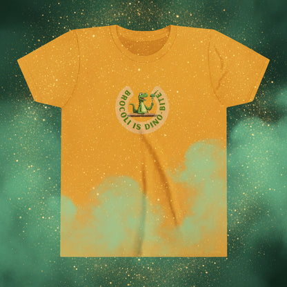 A mustard yellow short-sleeve t-shirt with a circular graphic on the chest featuring a green cartoon dinosaur and the text 'BROCOLI IS DINO BITE'.