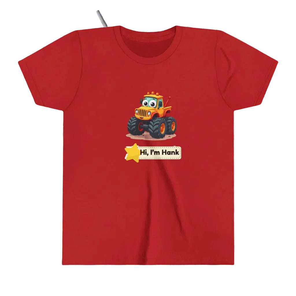 A red short-sleeve crewneck kids' t-shirt featuring a cartoon graphic of a cheerful yellow/orange monster tire truck with a yellow star and a name tag that reads 'Hi, I'm Hank'.