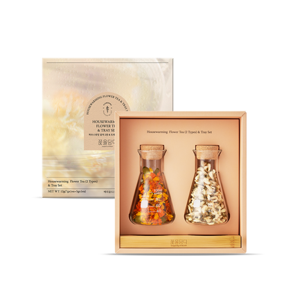 Two glass bottles with tea bags inside a wooden box, with packaging on the side.