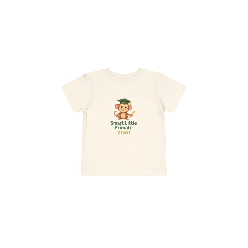 Toddler T‑shirt with a cheerful monkey wearing a graduation cap and holding a diploma, with the text ‘Smart Little Primate 2026" on the front of the natural colored tee.
