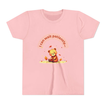 Pink t-shirt with a bear graphic and text on a white background