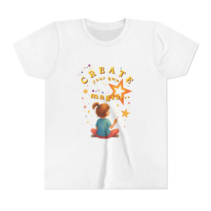 White t-shirt with a colorful graphic and text 'Create your own magic!' on a white background