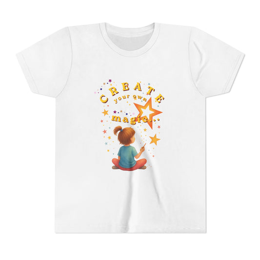 White t-shirt with a colorful graphic and text 'Create your own magic!' on a white background