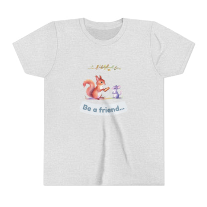 White t-shirt with a cartoon squirrel and mouse design and 'Be a friend' text on a white background