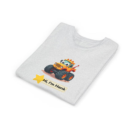 A light gray heathered t-shirt folded neatly, featuring a cartoon graphic of an orange and yellow monster truck with the text 'Hi, I'm Hank' and a yellow star on the front.