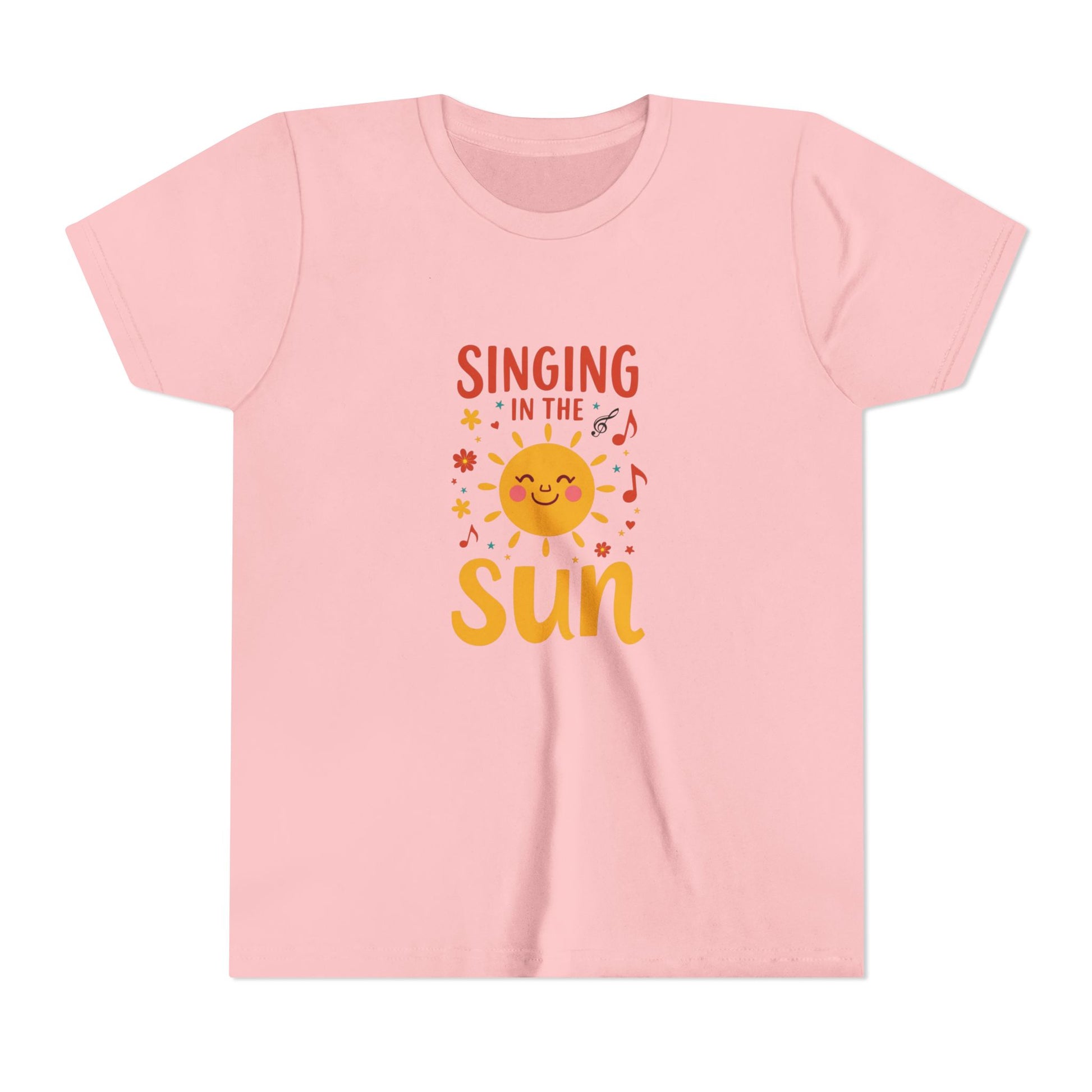 Pink t-shirt with 'Singing in the Sun' graphic design on a white background