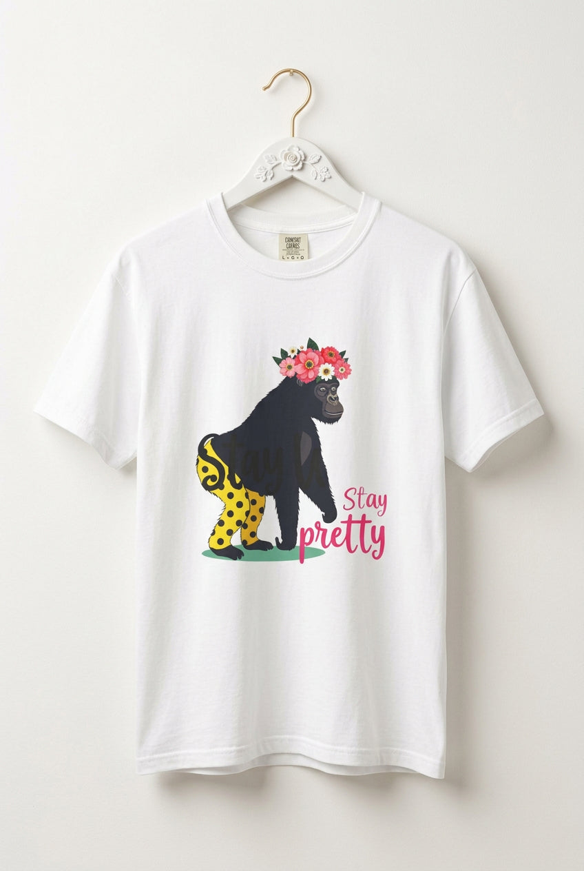 “Girl‑Girl™ gorilla wearing a flower crown and patterned shorts on a white unisex tee with the phrase ‘Stay Pretty.’”