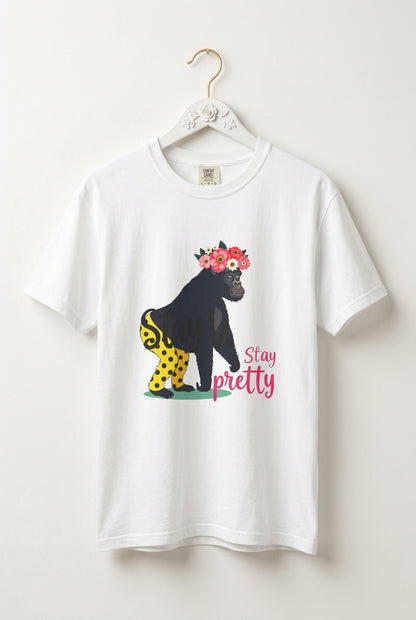 “Girl‑Girl™ gorilla wearing a flower crown and patterned shorts on a white unisex tee with the phrase ‘Stay Pretty.’”