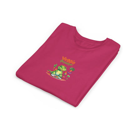 A folded magenta pink t-shirt with a cartoon graphic of a green frog wearing sunglasses and the text 'Veggie Power' in orange, displayed on a clean white background.