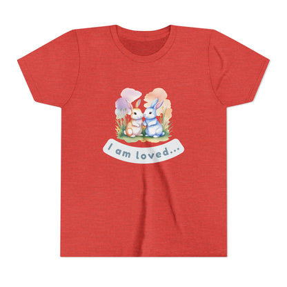 Red t-shirt with cartoon bunnies and 'I am loved' text on a white background