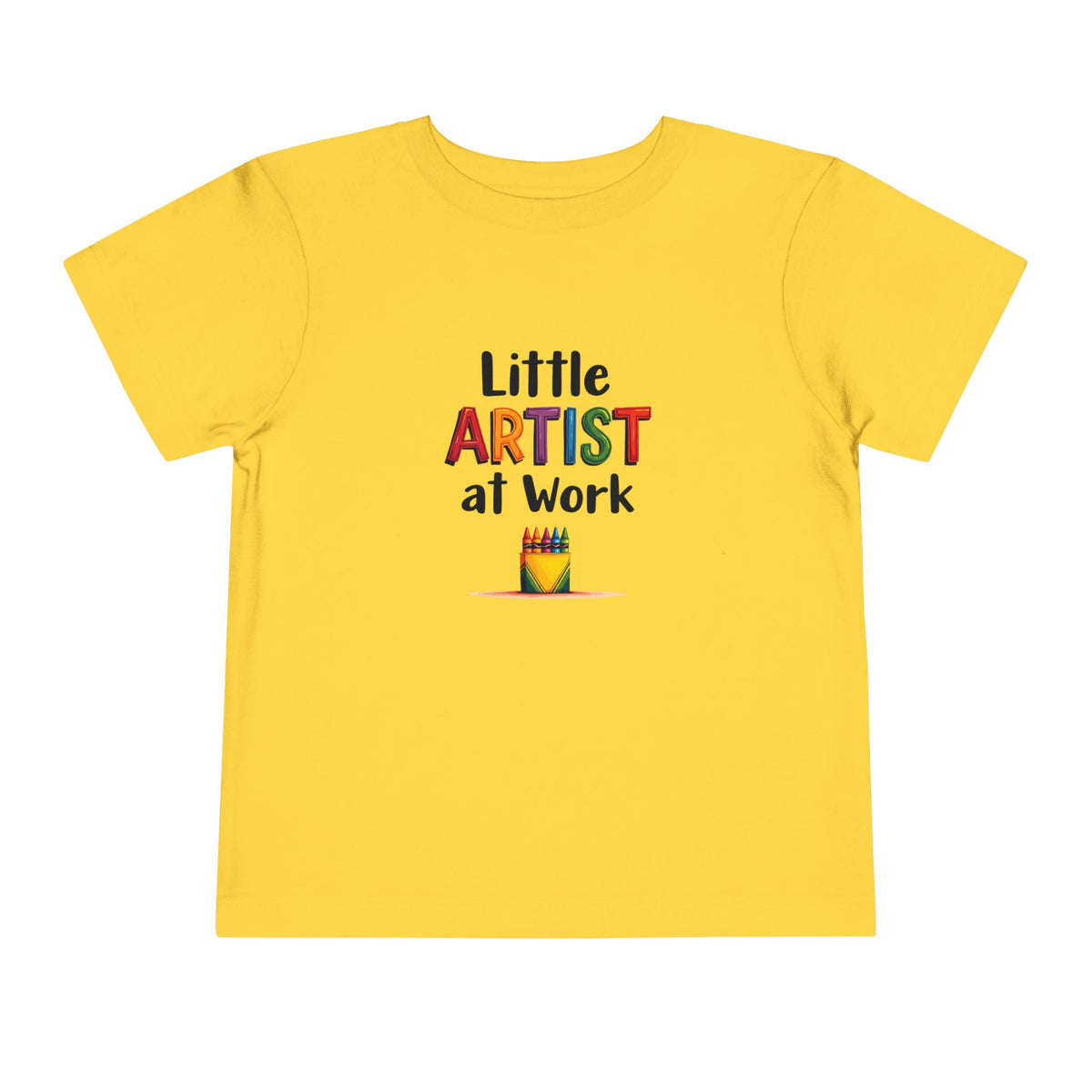 A yellow short-sleeve toddler's t-shirt with a colorful graphic on the chest that reads 'Little ARTIST at Work' above a small crayon box illustration, shown on a plain white background.