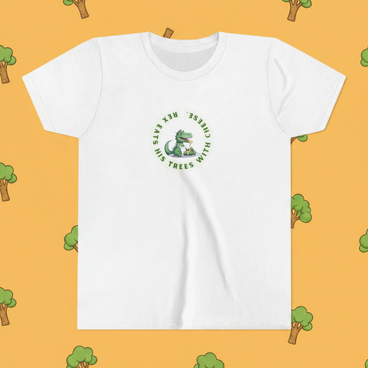 A white short-sleeve crewneck t-shirt featuring a green circular graphic on the chest with a cartoon dinosaur and the text 'Eats his TREES with CHEESE!'.
