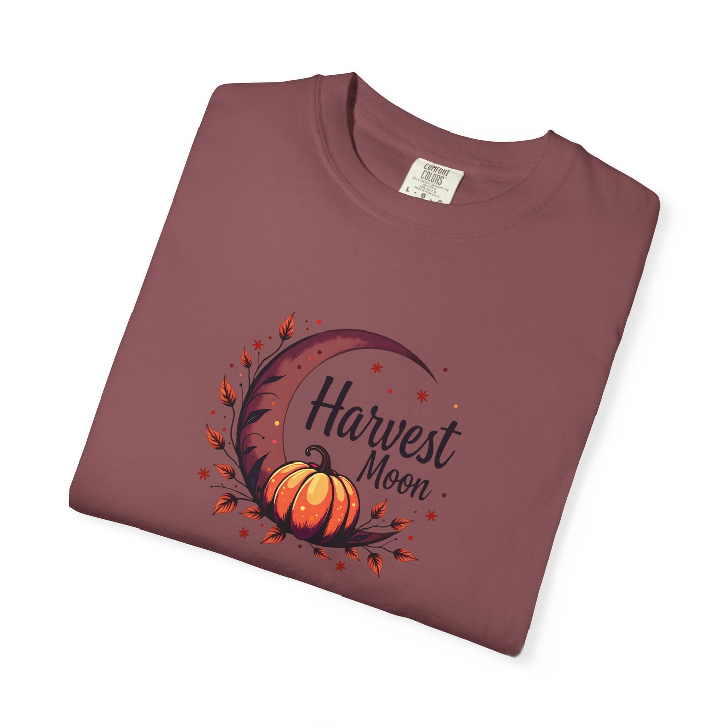 Folded expresso purple-ish t-shirt with black tree design on a white background
