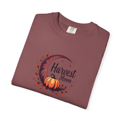 Folded expresso purple-ish t-shirt with black tree design on a white background