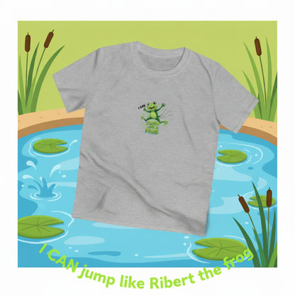 A heather gray short-sleeve t-shirt with a green cartoon frog graphic on the chest. The graphic features a frog jumping with the text, "I can jump liek a frogn."Text at the bottom: I CAN jump like Ribert the frog."