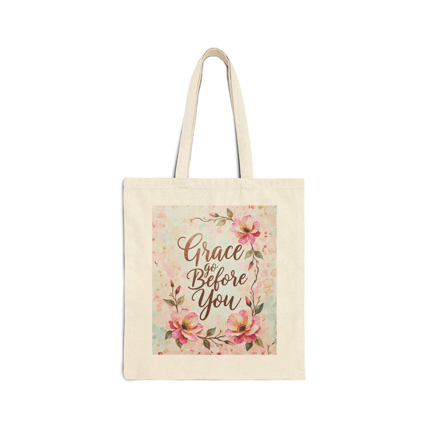Tote bag with floral design and 'Grace Go Before You' text on a white background