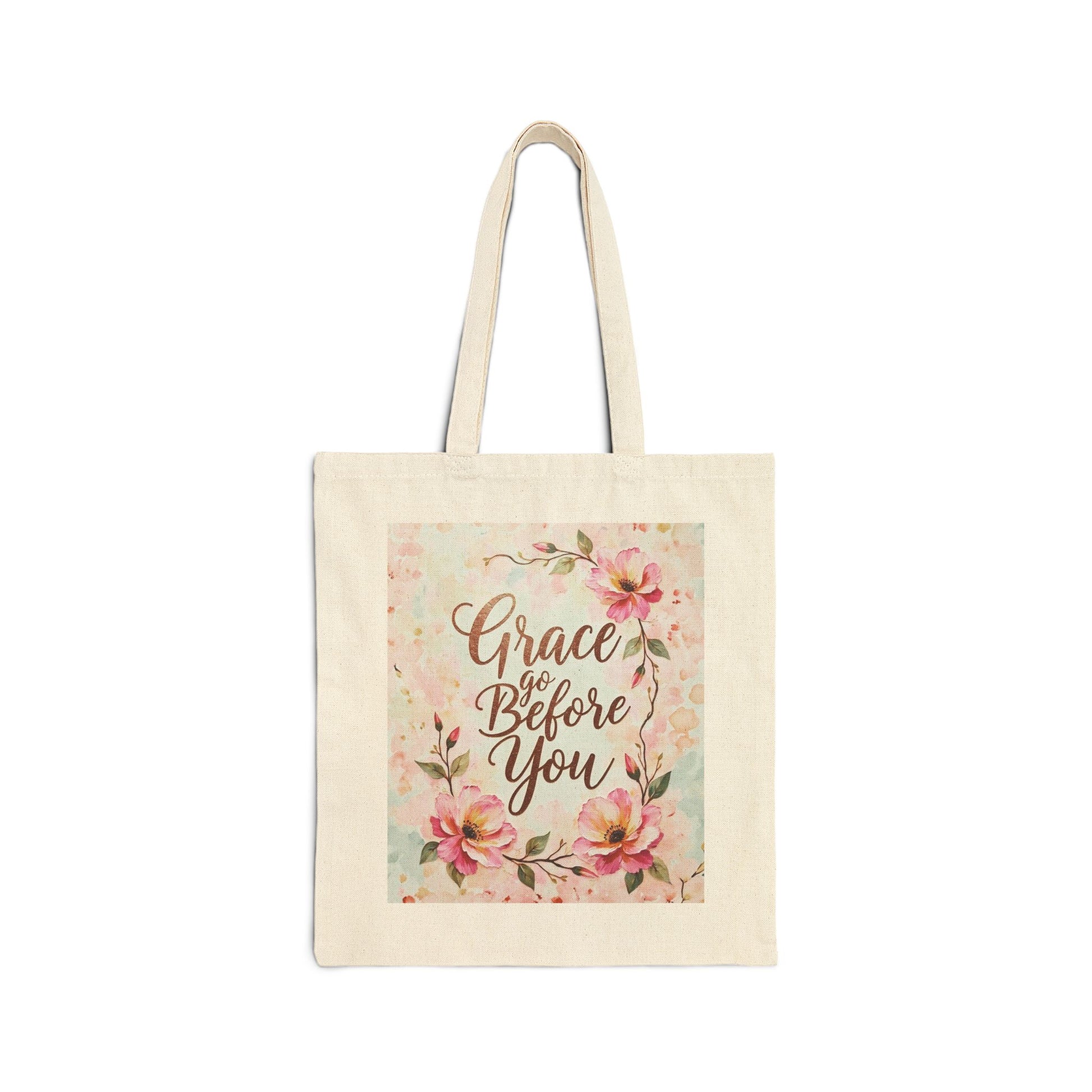 Tote bag with floral design and 'Grace Go Before You' text on a white background