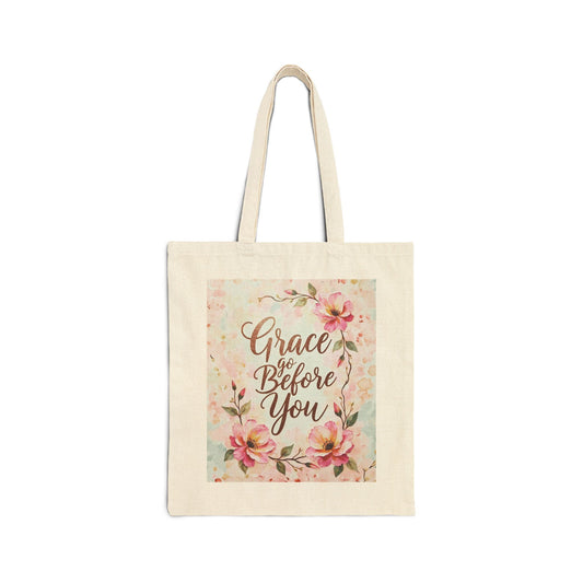 Tote bag with floral design and 'Grace Go Before You' text on a white background