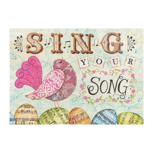 Decorative sign with 'Sing Your Song' text and colorful birds on a light blue background