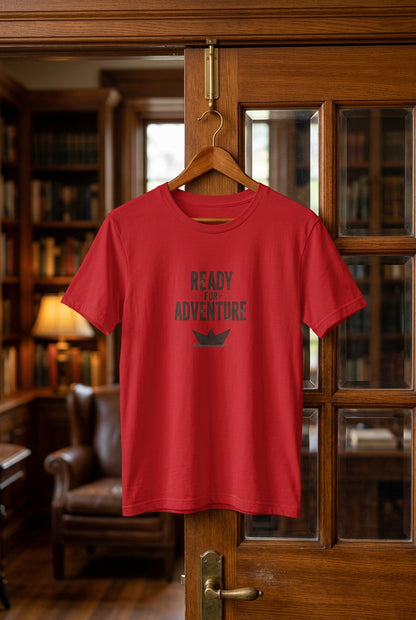 Kids red T‑shirt with bold black “Ready for Adventure” text and a small paper boat graphic.