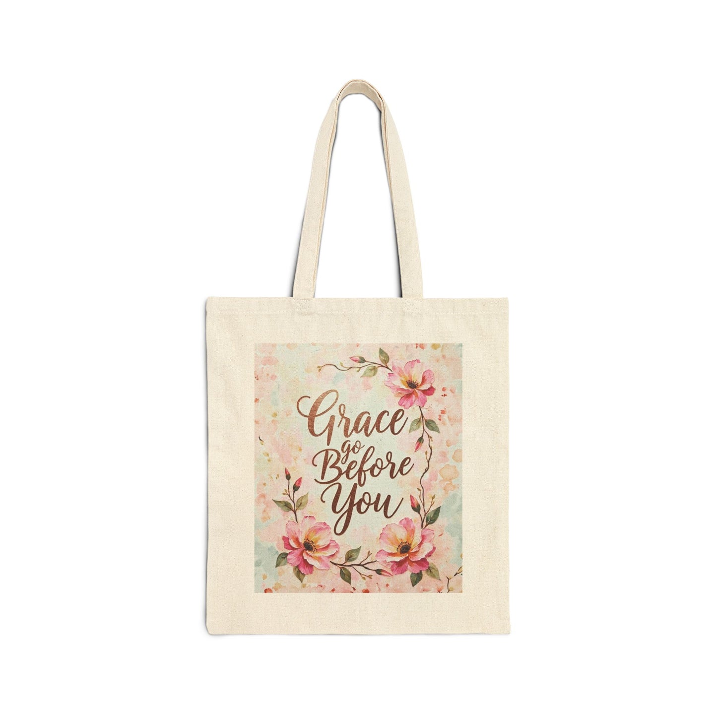 Tote bag with floral design and 'Grace Go Before You' text on a white background