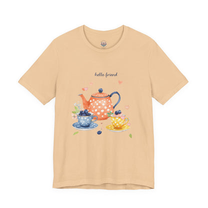 Beige t-shirt with a tea-themed graphic and 'hello friend' text on a white background