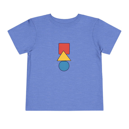 A heather blue short-sleeve t-shirt with a central graphic of stacked geometric shapes: a red square, a yellow triangle, and a teal circle.