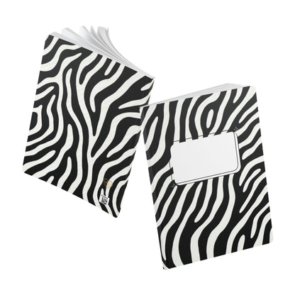 Two zebra-patterned notebooks on a white background