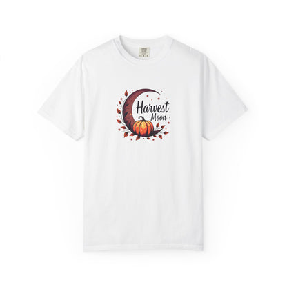 A white short-sleeve crewneck t-shirt featuring a central graphic of a crescent moon, autumn leaves, a pumpkin, and the text 'Harvest Moon' in dark brown script.