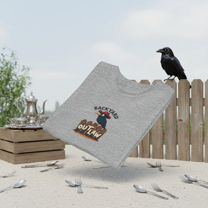 Folded grey T-shirt. Text says, "Backyard Outlaw" with a cartoon crow Graphic of a black row wearing a red cowboy hat and sitting on a wooden fence.