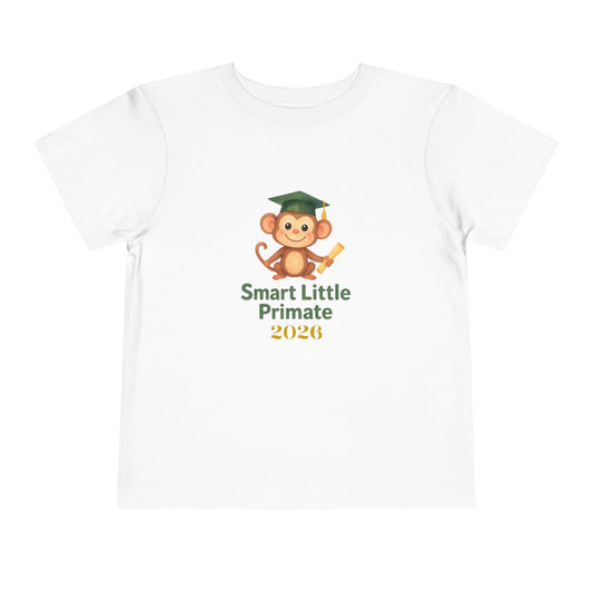 “Toddler T‑shirt with a cheerful monkey wearing a graduation cap and holding a diploma, with the text ‘Smart Little Primate 2026’ on the front.”