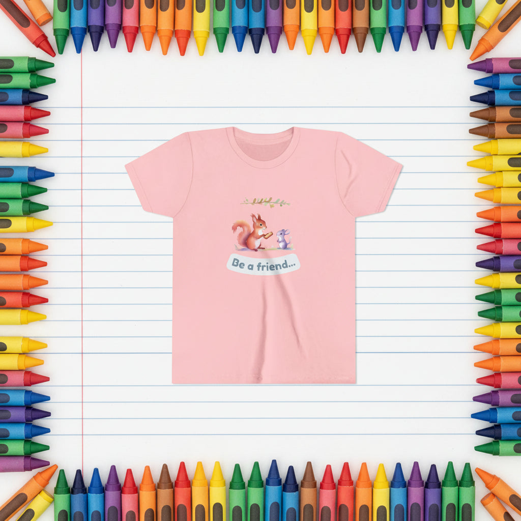 Pink t-shirt with a cartoon squirrel and mouse design and 'Be a friend' text on a white background