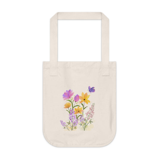 Beige tote bag with floral design on a white background