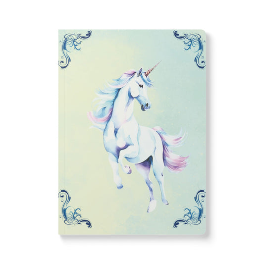 Notebook with a unicorn design on a light blue background
