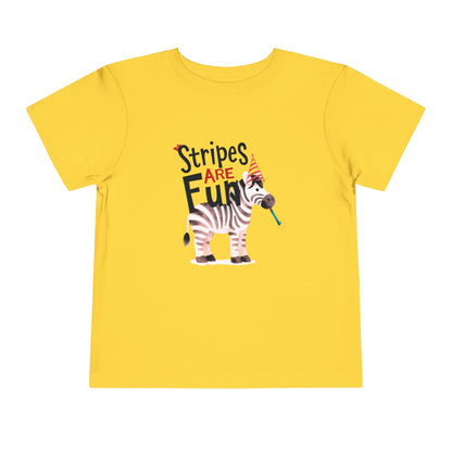 Yellow Toddler t-shirt with a zebra wearing a striped party hat and blowing a striped party blower, with text reading ‘Stripes Are FUN.’